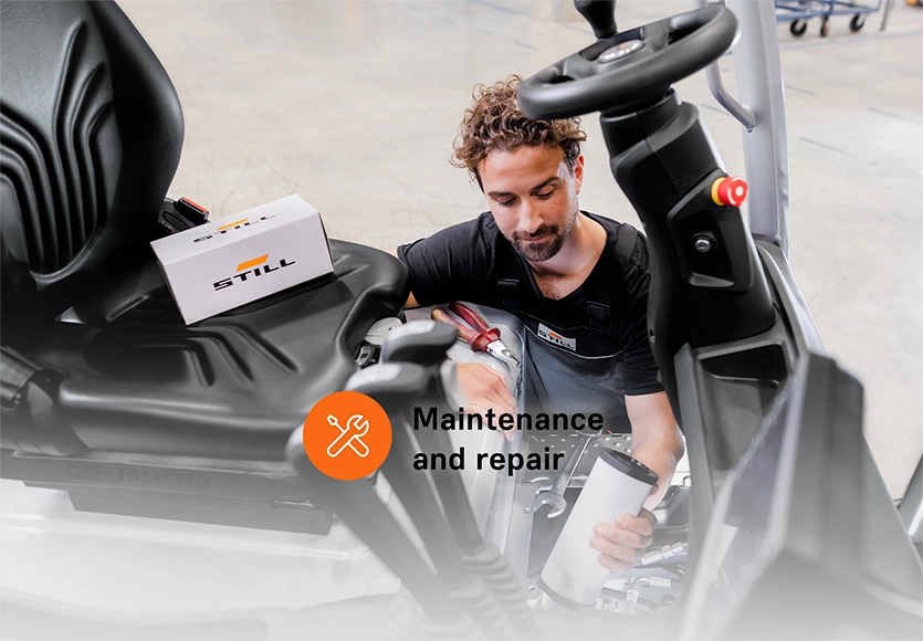 A STILL service technician holds a filter cartridge while servicing a forklift, labelled “Maintenance and repair".