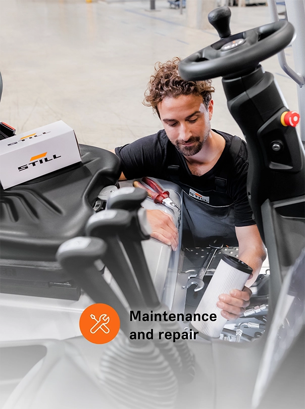 A STILL service technician holds a filter cartridge while servicing a forklift, labelled “Maintenance and repair".